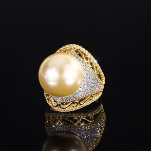 A golden bead ring with a pale gold color.